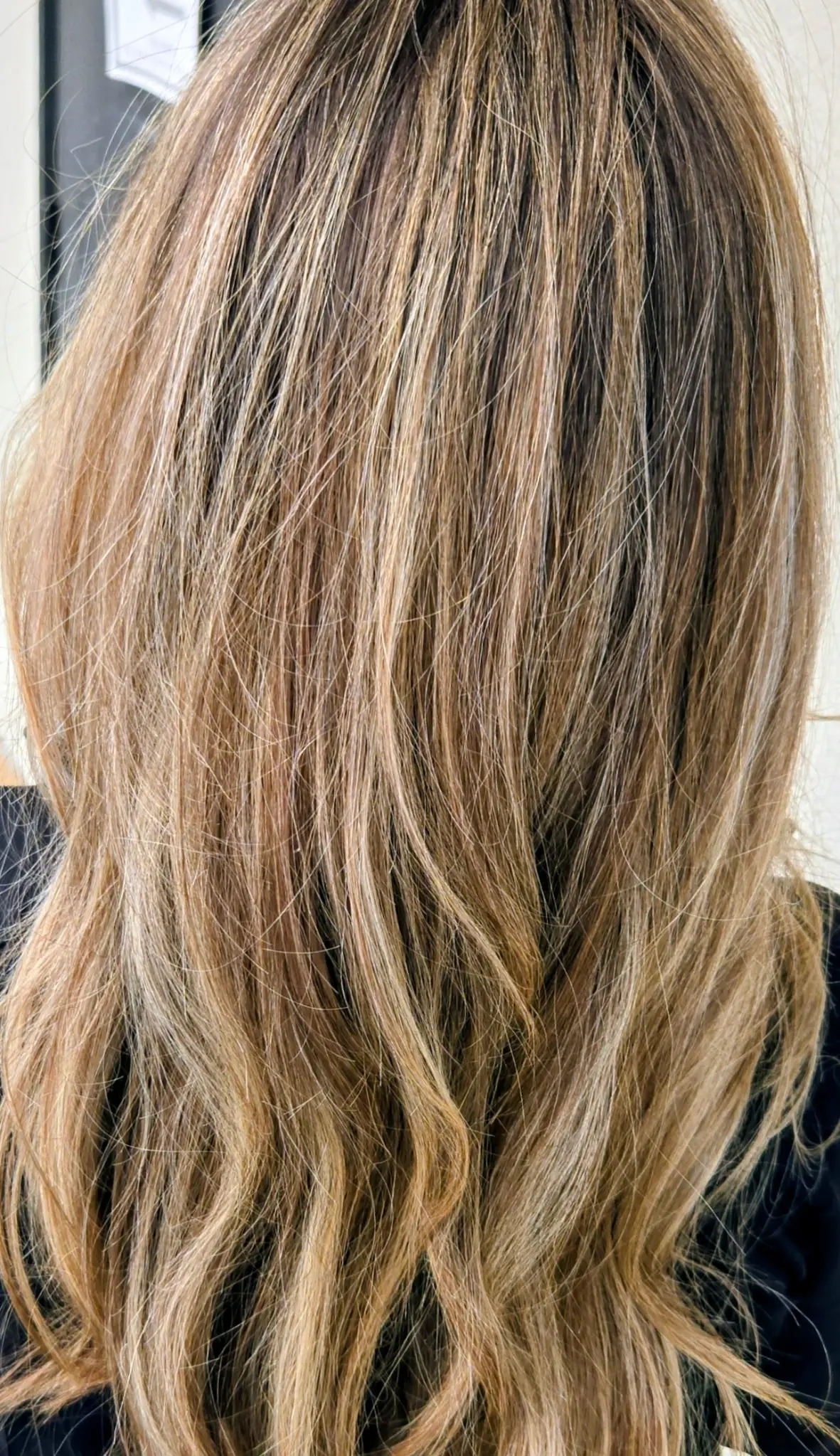 Beautiful blonde hair with professional highlights and lowlights showing expert color artistry and dimensional techniques